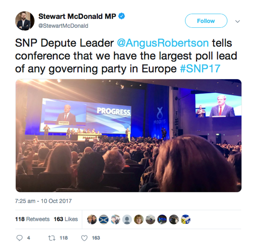 A tweet with a photo of a party conference.